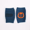 Baby knee pads in navy with lion design, non-slip crawling cushions for infants and toddlers.