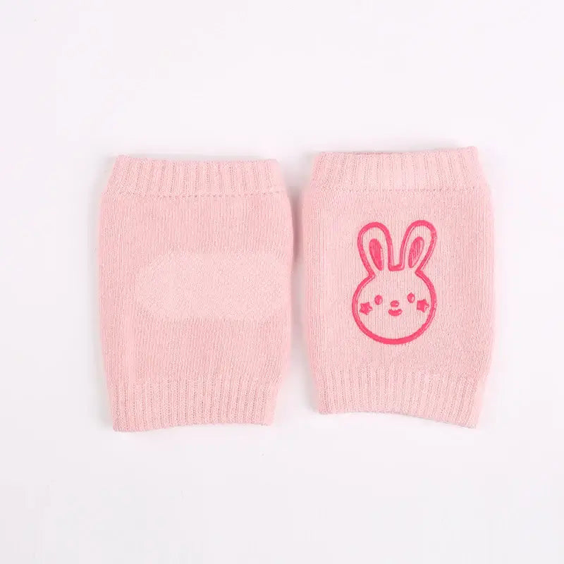 Pink baby knee pads with cute rabbit design, non-slip crawling cushion for infants, perfect for all seasons.