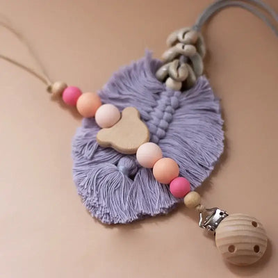 Custom purple wooden bead pacifier chain with natural fibers suitable for newborns, teether and dummy holder.