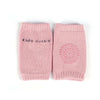 Pink kids leg warmers with grippy soles, suitable for infants and toddlers, designed for safety during crawling.