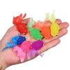 Colorful set of 10 kawaii rubber goldfish toys in a child's hand for bath water play and games.