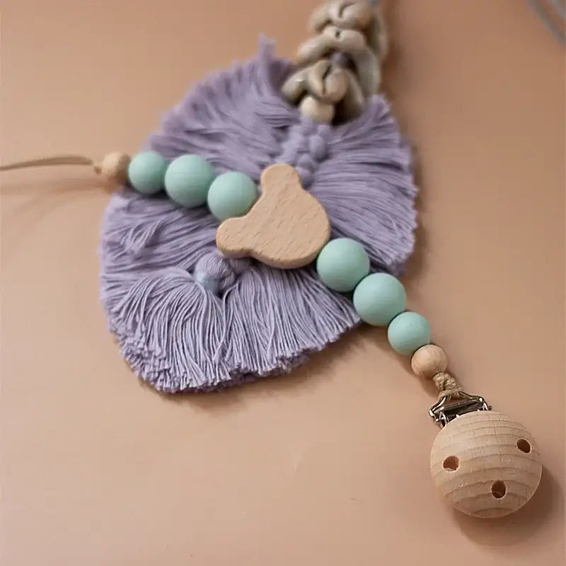 Custom personalized baby pacifier chain with silicone beads and wooden elements, perfect for newborns and teething.