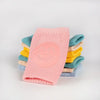 Colorful baby knee pads with smiley face design, ideal for infants and toddlers during crawling, made from soft cotton.