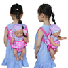 Child carrying a doll in a colorful backpack carrier, demonstrating a doll accessory for 15 to 18 inch dolls.