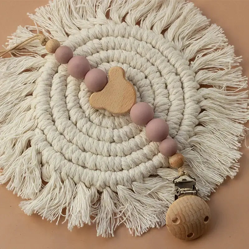 Custom name wooden pacifier chain with silicone beads for newborns, stylish and safe teether holder.