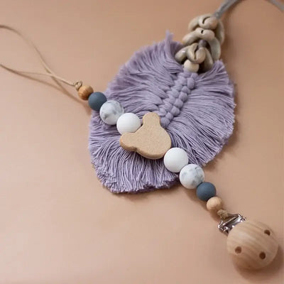 Custom wooden baby pacifier chain with silicone beads and teether pendant in lavender color.