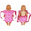 Pink doll carrier backpack for 15-18 inch dolls, featuring floral design and adjustable straps.