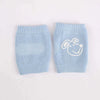 Blue baby knee pads with a cute dog design, ideal for infant crawling and leg protection.