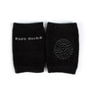 Black kids knee socks with rubber grip pattern for non-slip crawling, ideal for infants and toddlers.